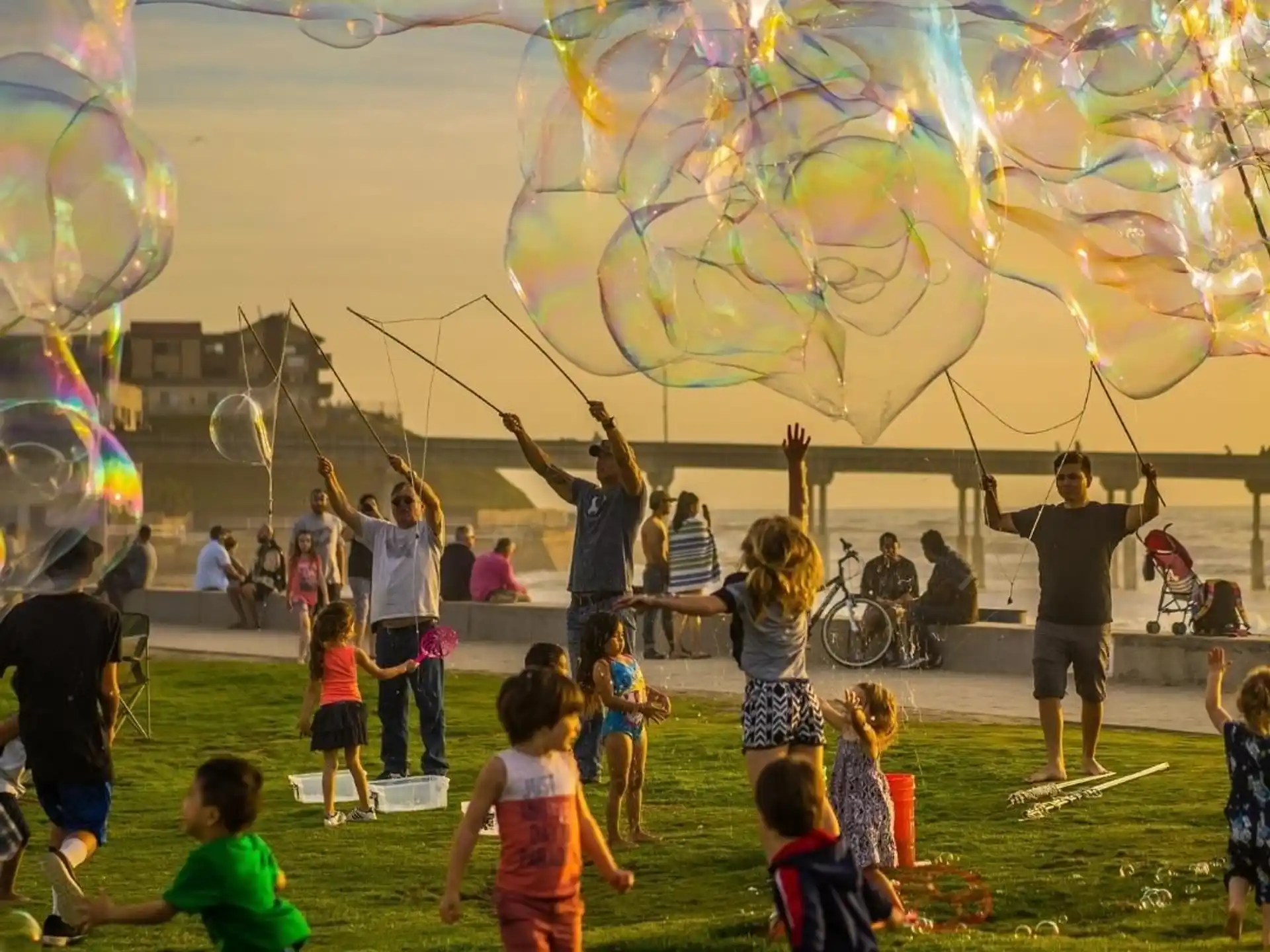 a group of children playing with bubbles