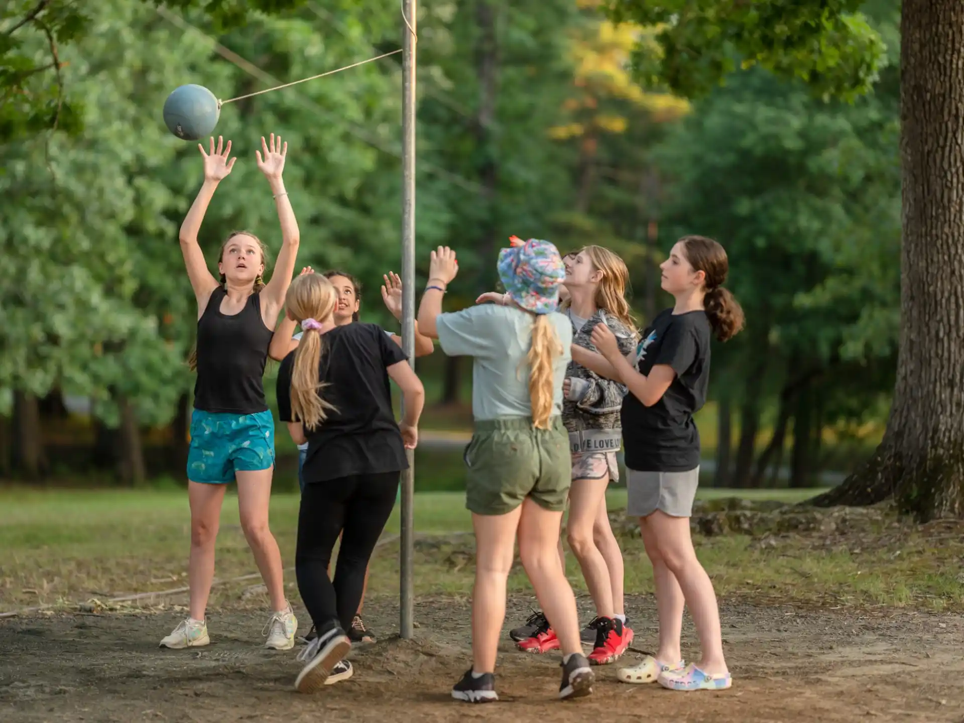 a group of girls playing with a ball