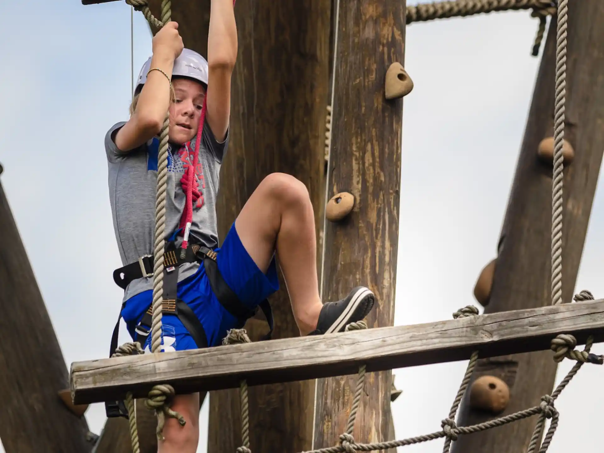 a person climbing a rope