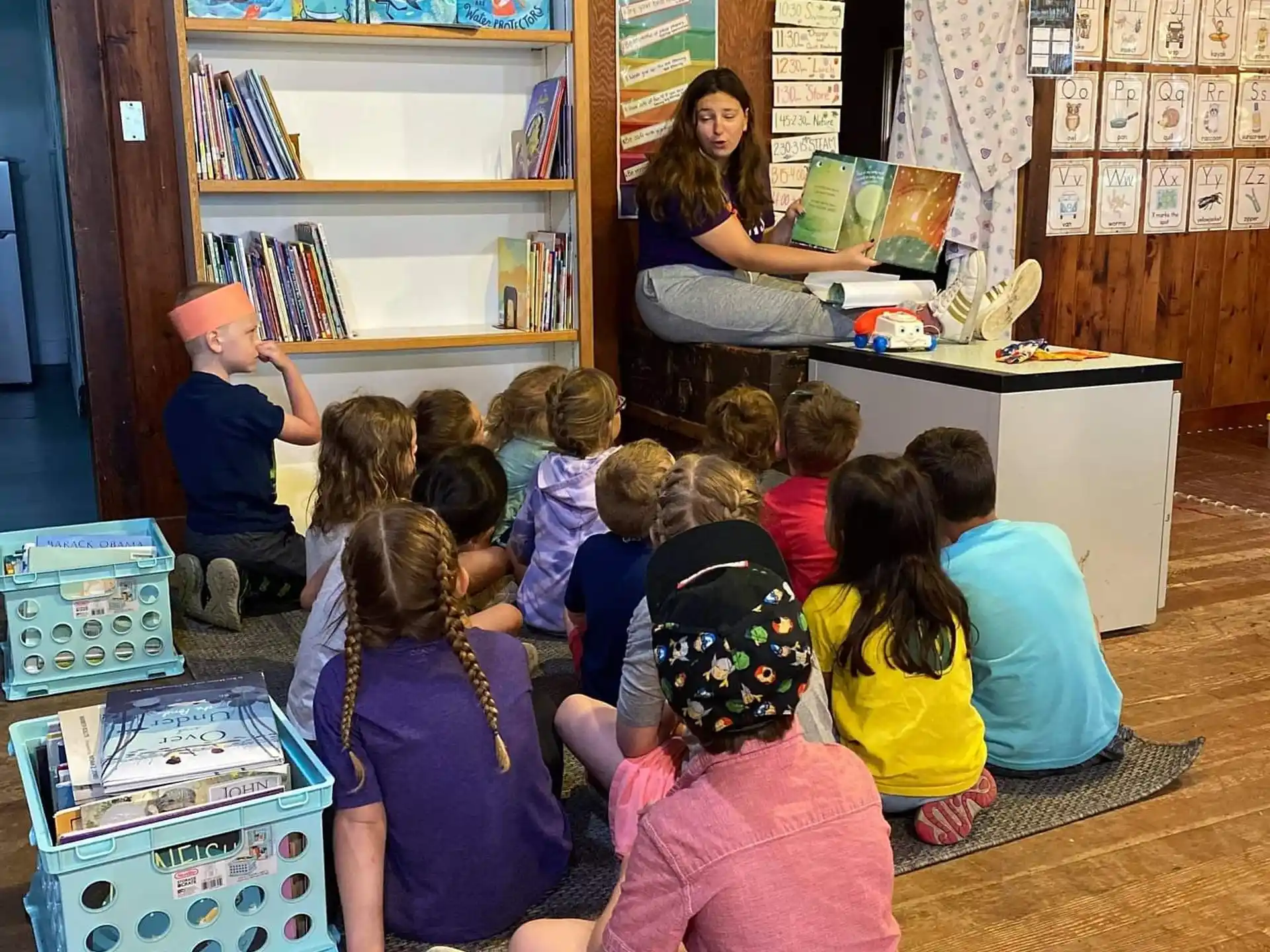a group of children sitting in a room