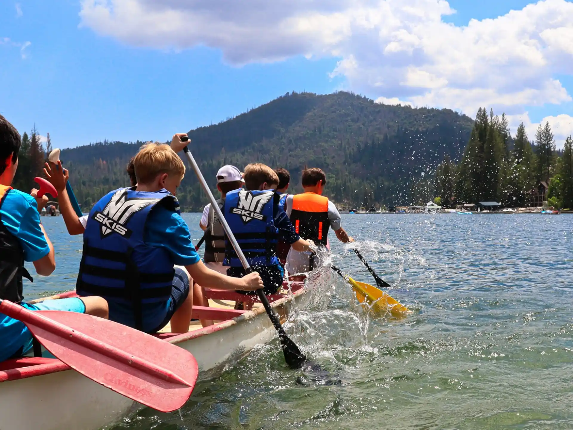 a group of people in kayaks