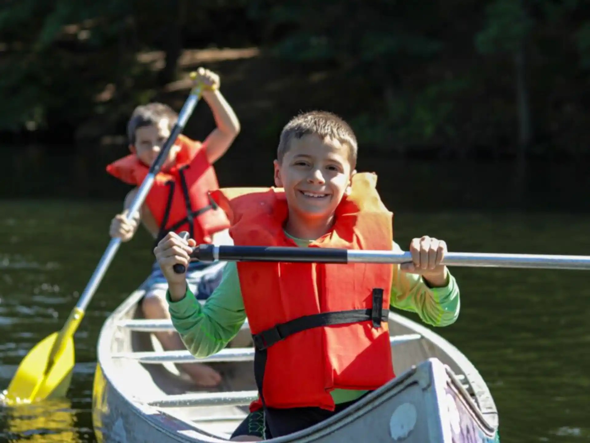 a group of people in a canoe