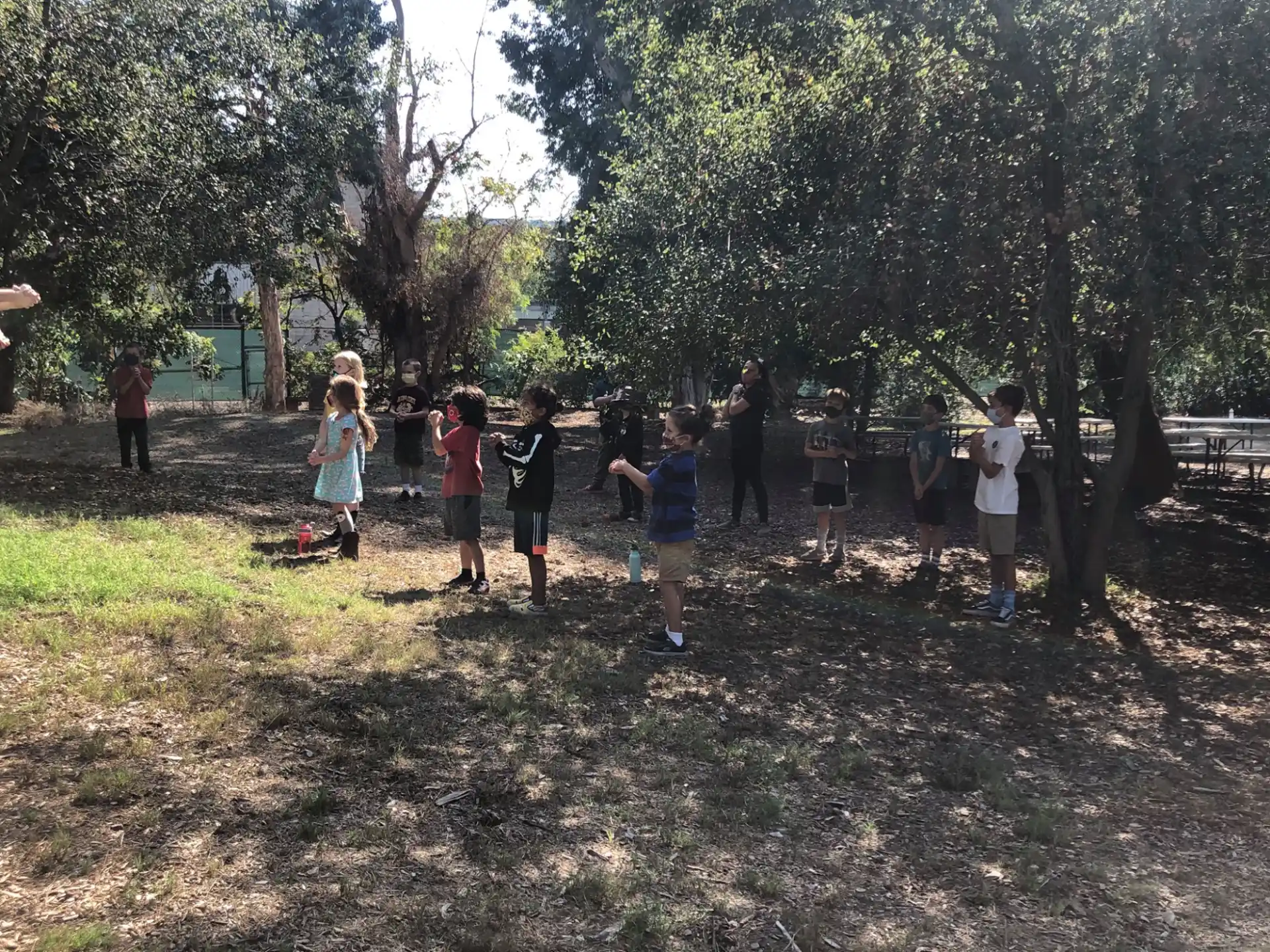a group of children playing in a park