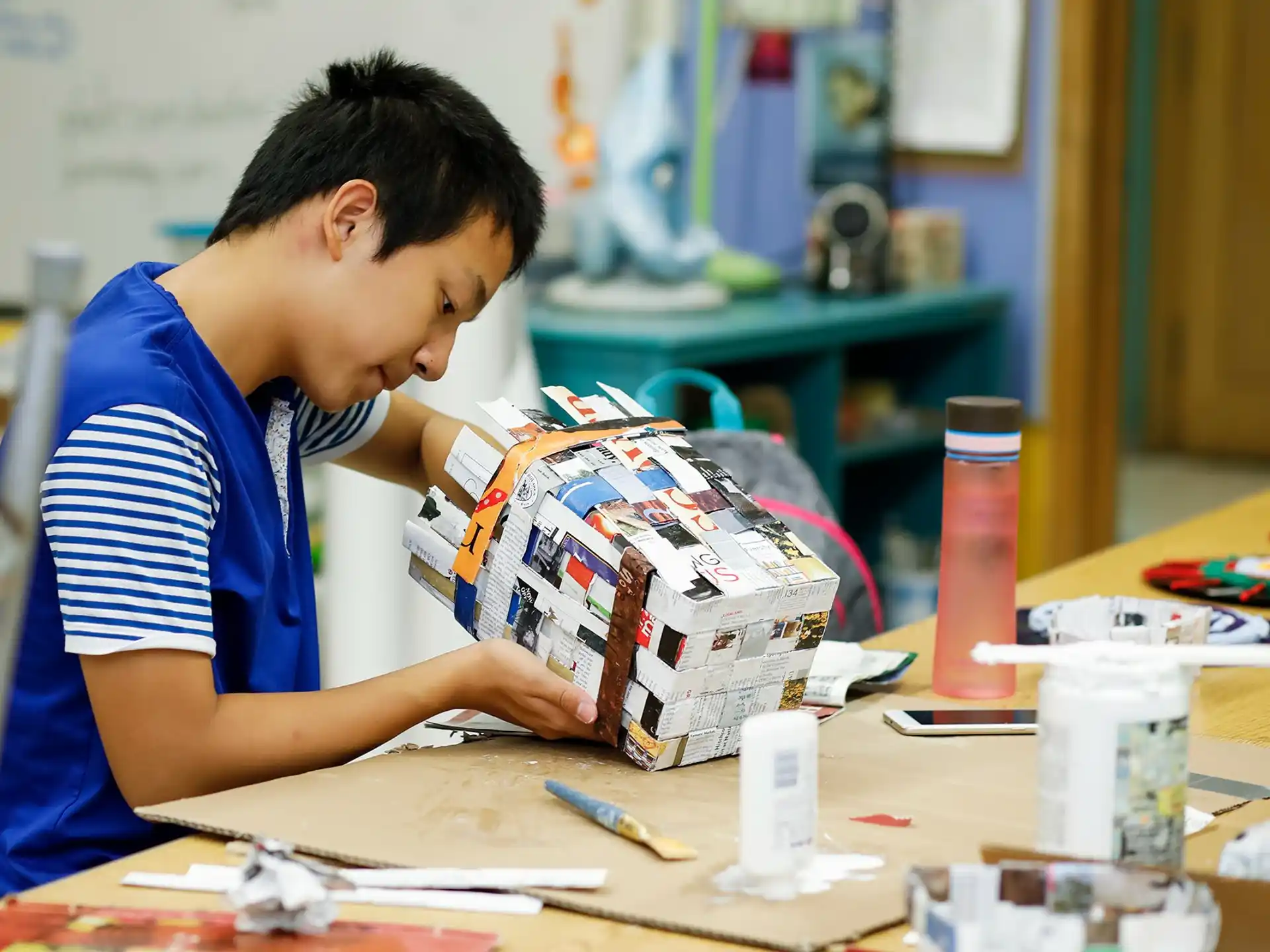 a young boy playing with a toy