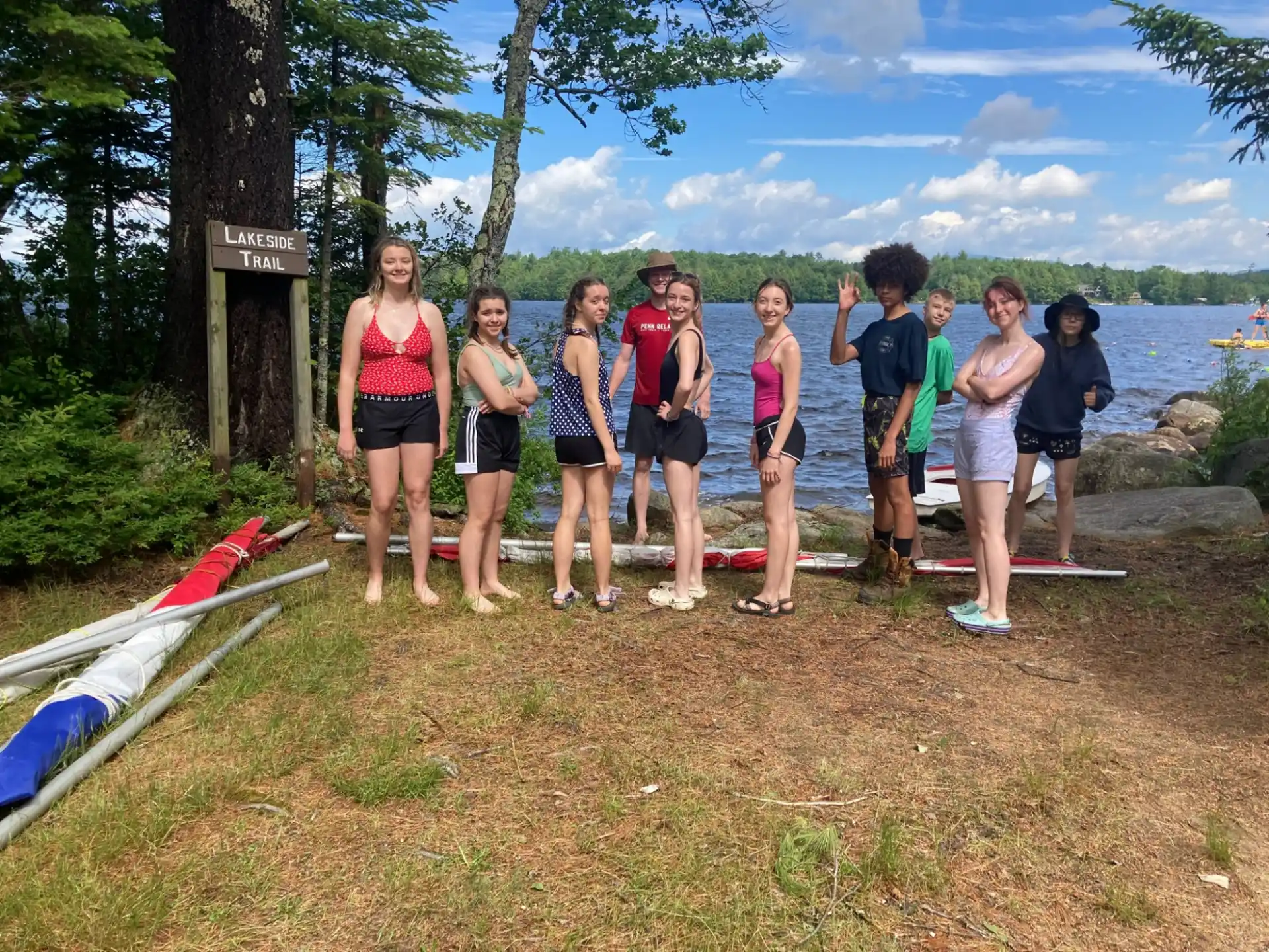 a group of people standing on a beach