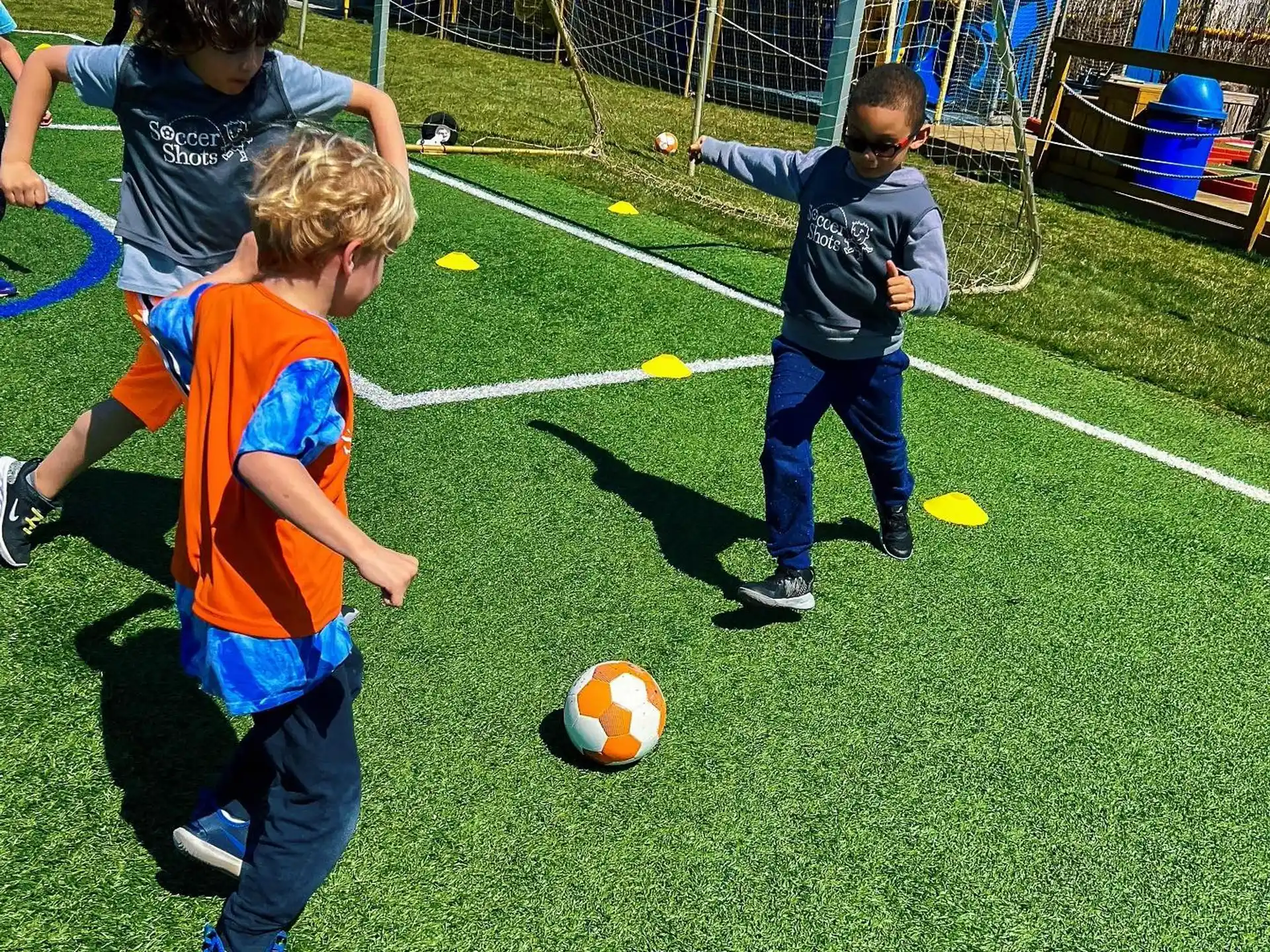 a group of kids playing with a ball