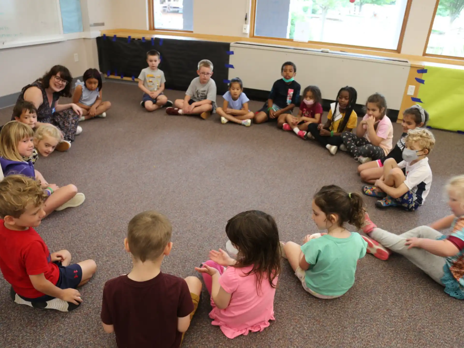 a group of children sitting on the floor