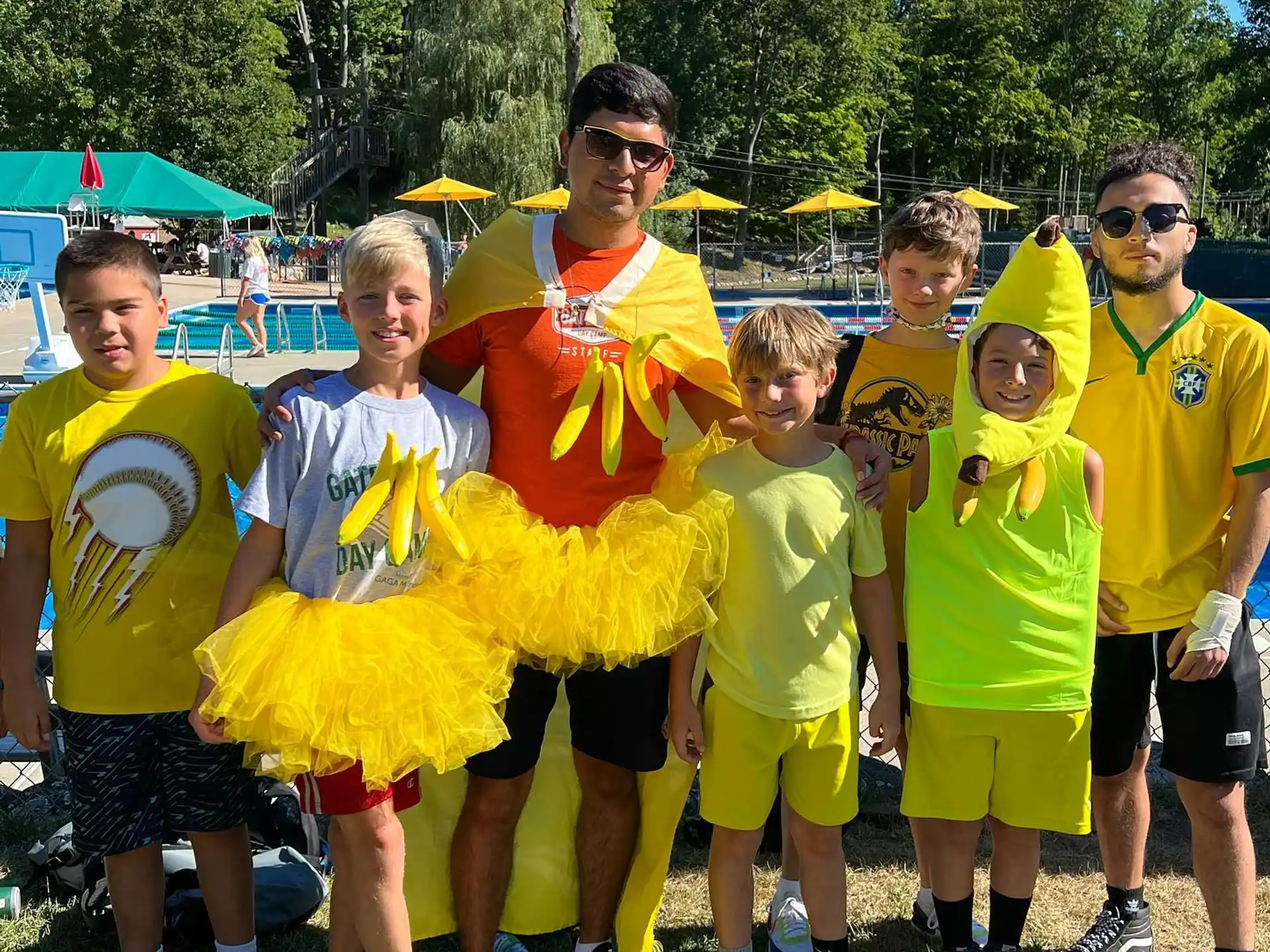 a group of people wearing yellow shirts