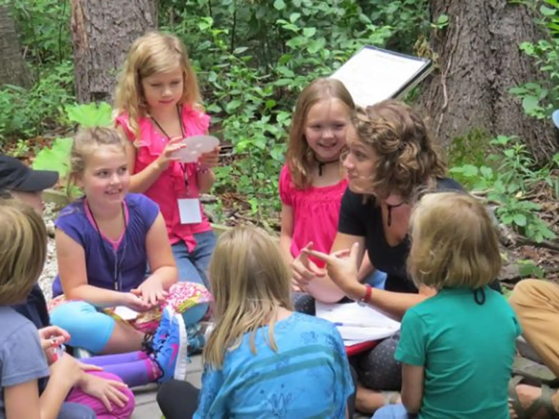 a group of children sitting in a circle