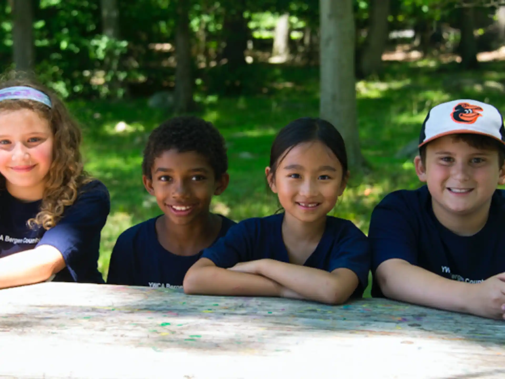 a group of children sitting in a pool