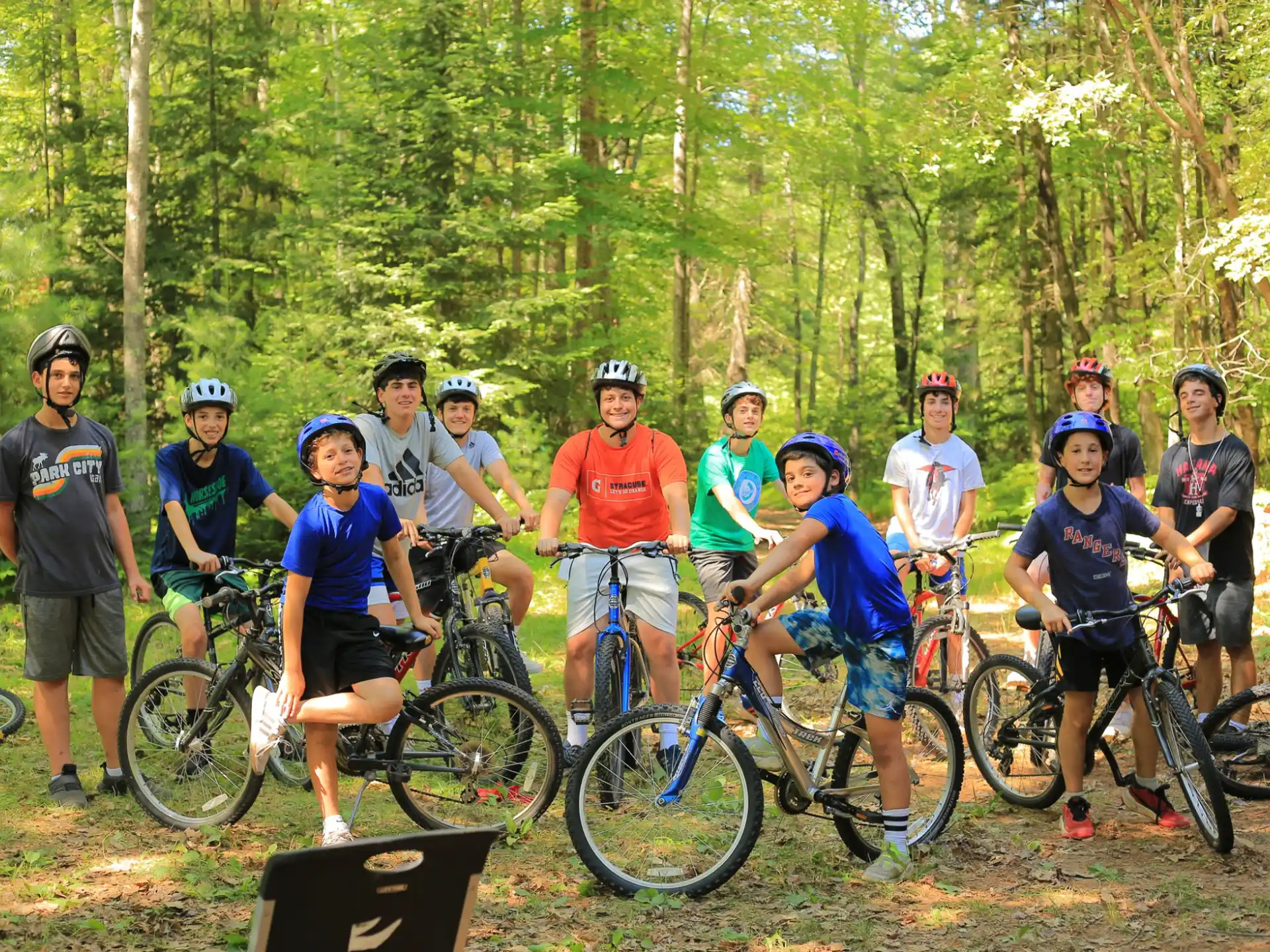 a group of people with bicycles