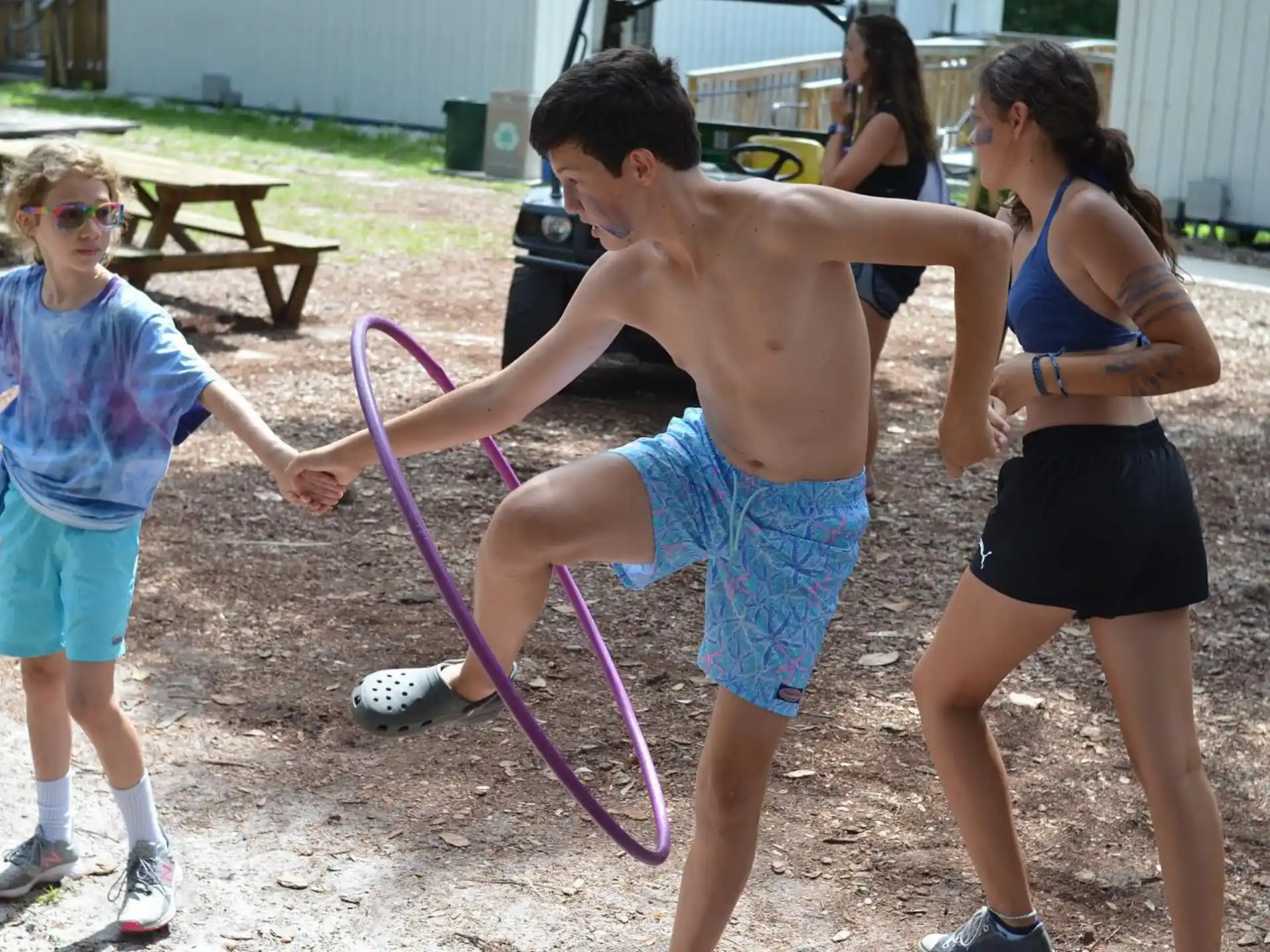 a group of people playing with a toy