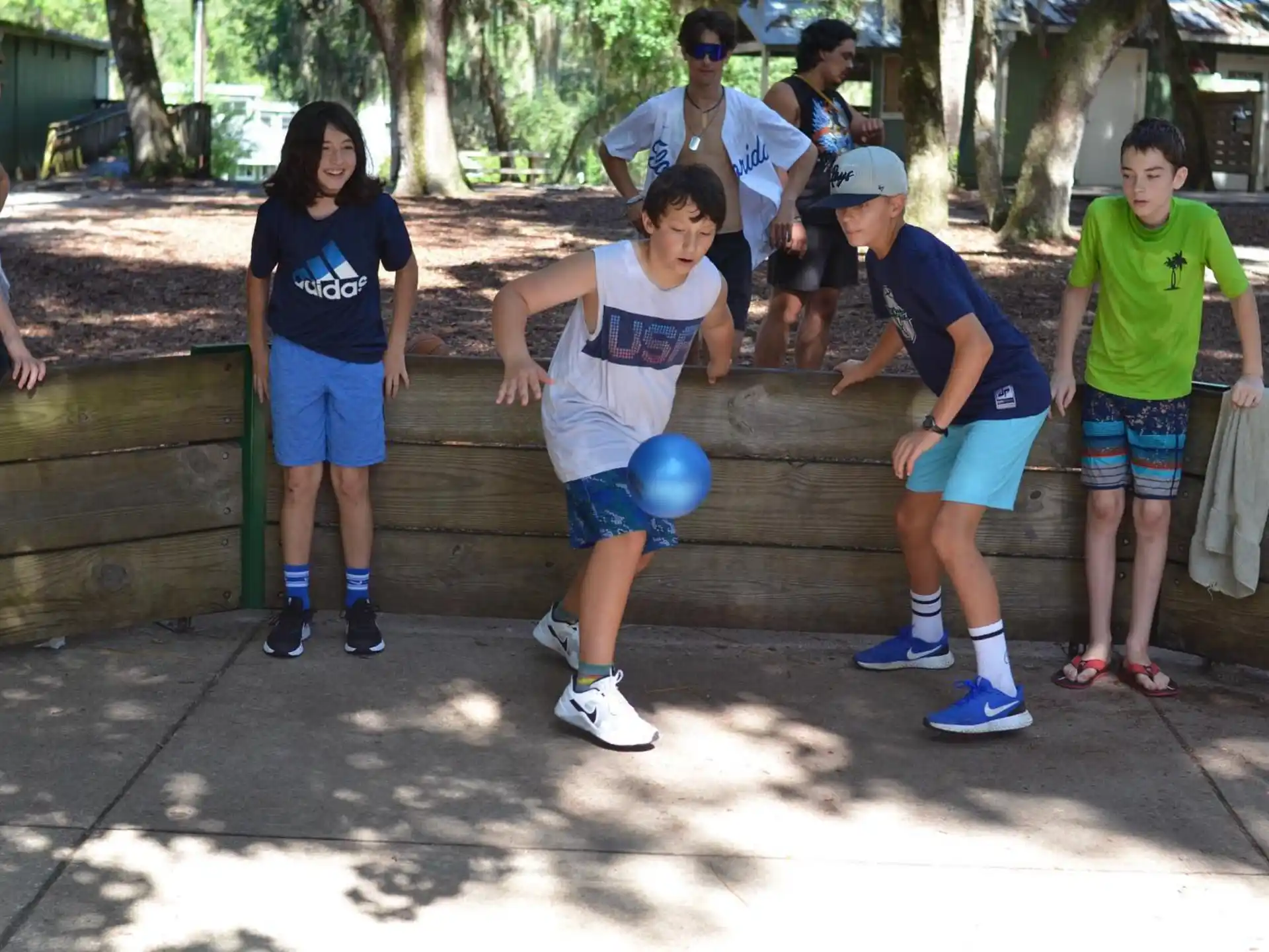 a group of people playing with balls