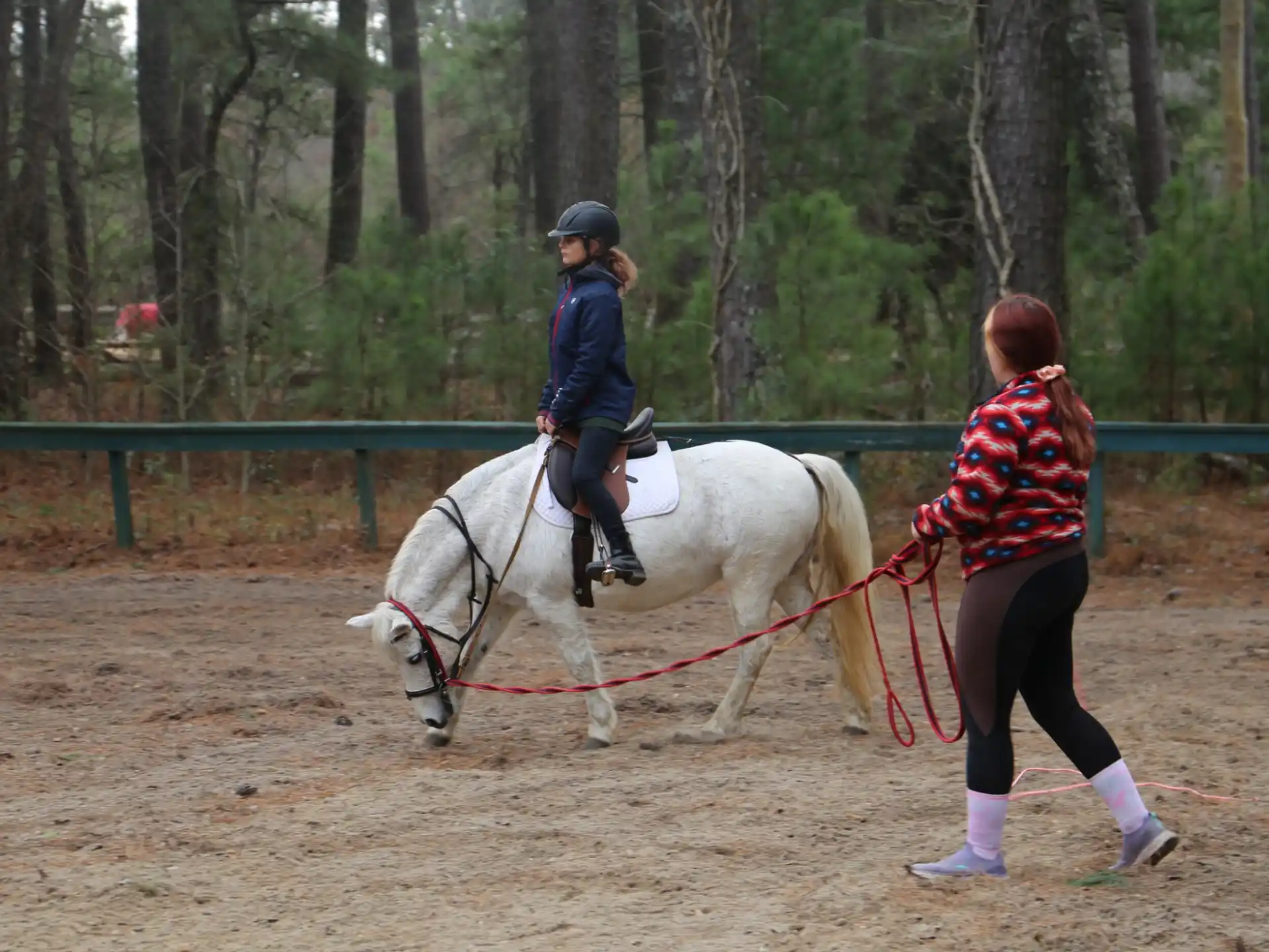 a girl riding a horse