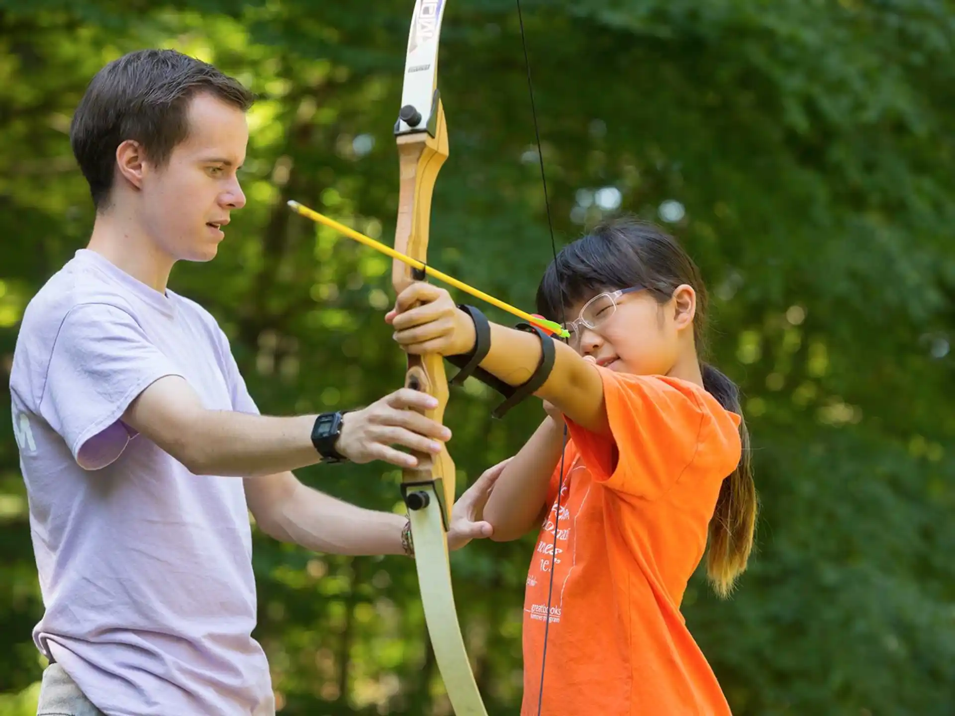a man and a woman holding a bow and arrow