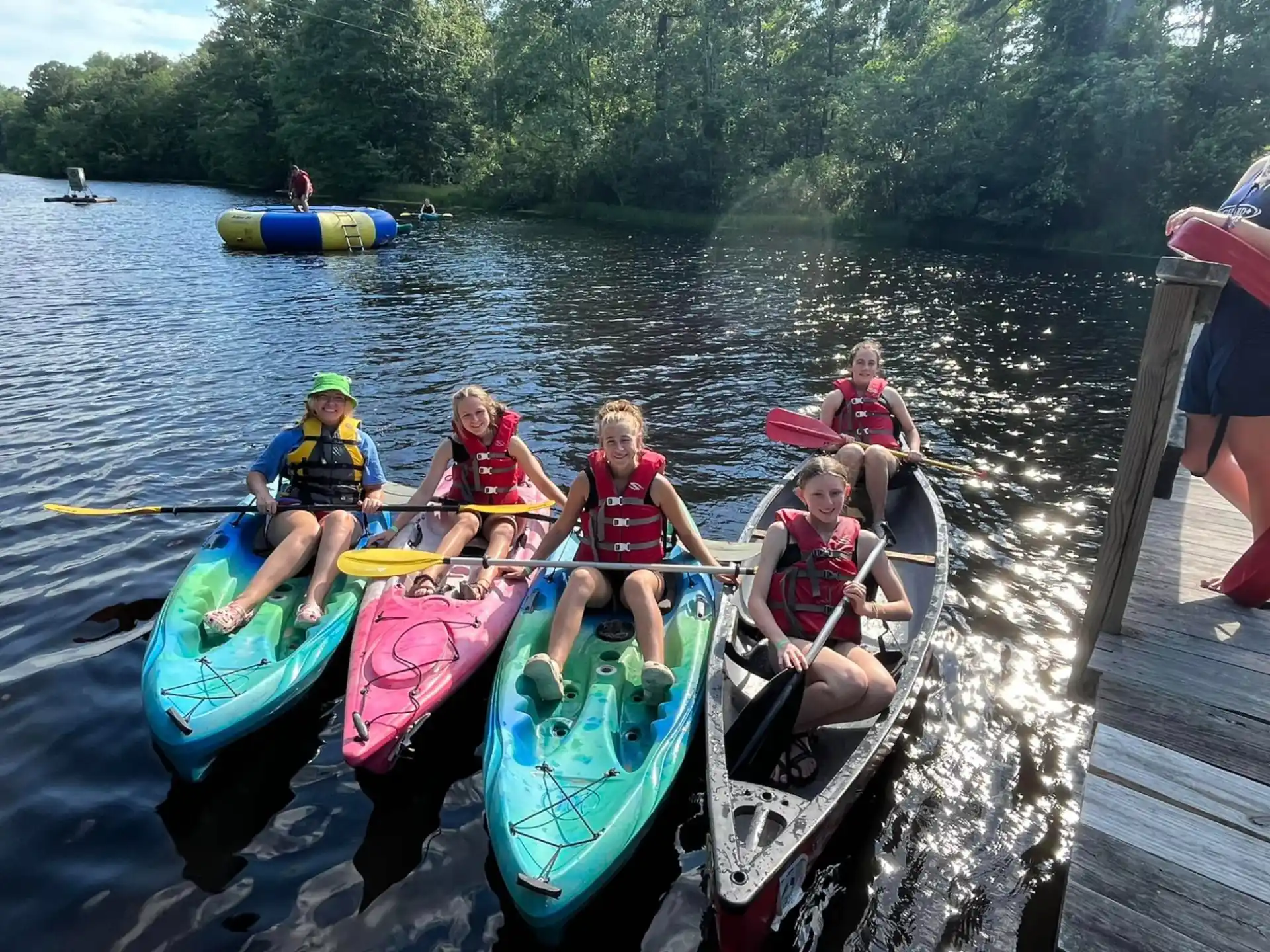 a group of people in kayaks