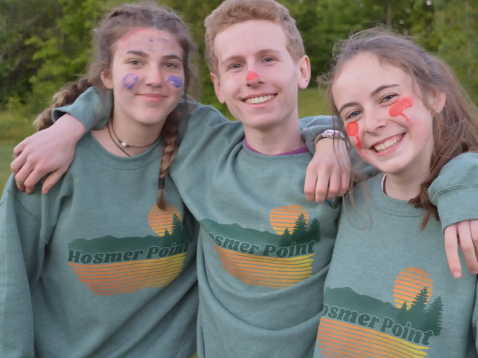 a group of children with paint on their faces